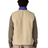 A model wearing the Patagonia mens classic retro x fleece vest available at Babipur showing the back fit of the gilet