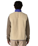 A model wearing the Patagonia mens classic retro x fleece vest available at Babipur showing the back fit of the gilet