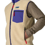 A close up of the Patagonia mens classic retro x fleece vest available at Babipur showing the side pocket and arm hole detail