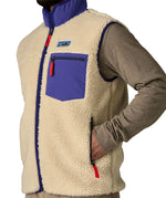 A close up of the Patagonia mens classic retro x fleece vest available at Babipur showing the side pocket and arm hole detail