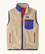 Patagonia mens classic retro x fleece vest available at Babipur. A dark beige coloured thick fleece with a royal blue trim. Features a full length zip, chest pocket and side pockets