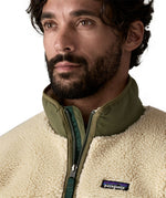 A close up of the Patagonia classic retro x jacket in natural/green available at Babipur showing the green turn up collar detail