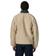 Back of man wearing the Patagonia classic retro x jacket in natural showing the green turned up collar