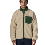 Man wearing the Patagonia classic retro x jacket in natural with green trim. Showing front zip, chest pocket and turned up collar 