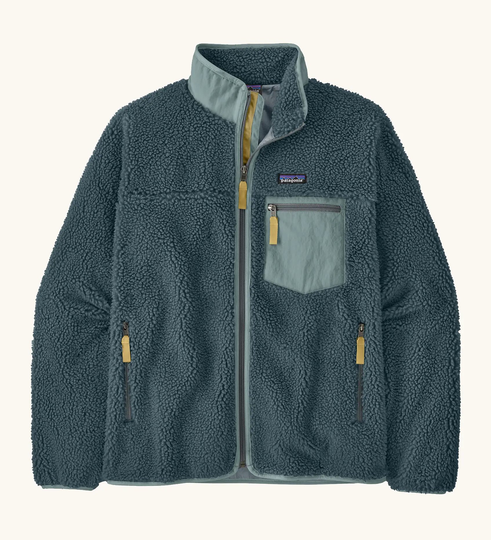 Patagonia Men’s Classic Retro-X Fleece Jacket in teal with a light blue trim. Features a full front zip, chest and side pockets