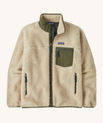 Patagonia men's thick fleece jacket in a cream colour. Features a full length front zip, side pockets and a dark green patch pocket.