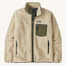 Patagonia men's thick fleece jacket in a cream colour. Features a full length front zip, side pockets and a dark green patch pocket.