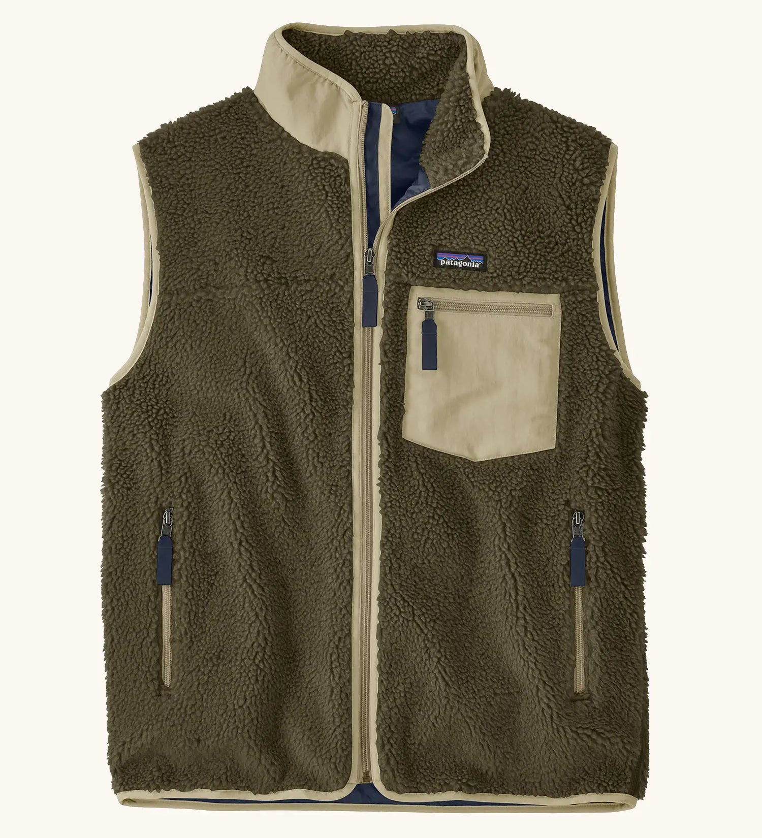 Patagonia men's classic retro x warm fleece vest in dark green with a contrast trim. Features a front zip, chest and side pockets