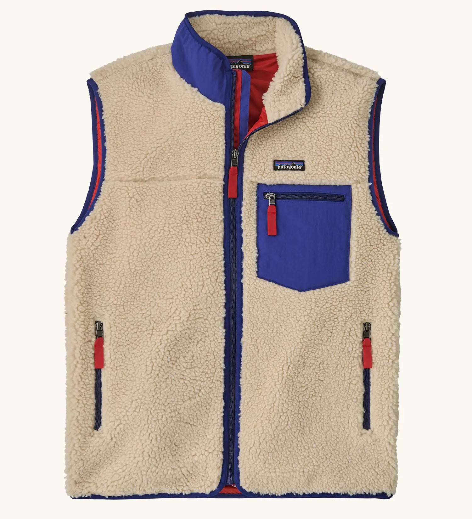 Patagonia men's classic retro x warm fleece vest in beige with cobalt blue trim. Features a front zip, chest and side pockets