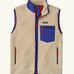 Patagonia men's classic retro x warm fleece vest in beige with cobalt blue trim. Features a front zip, chest and side pockets