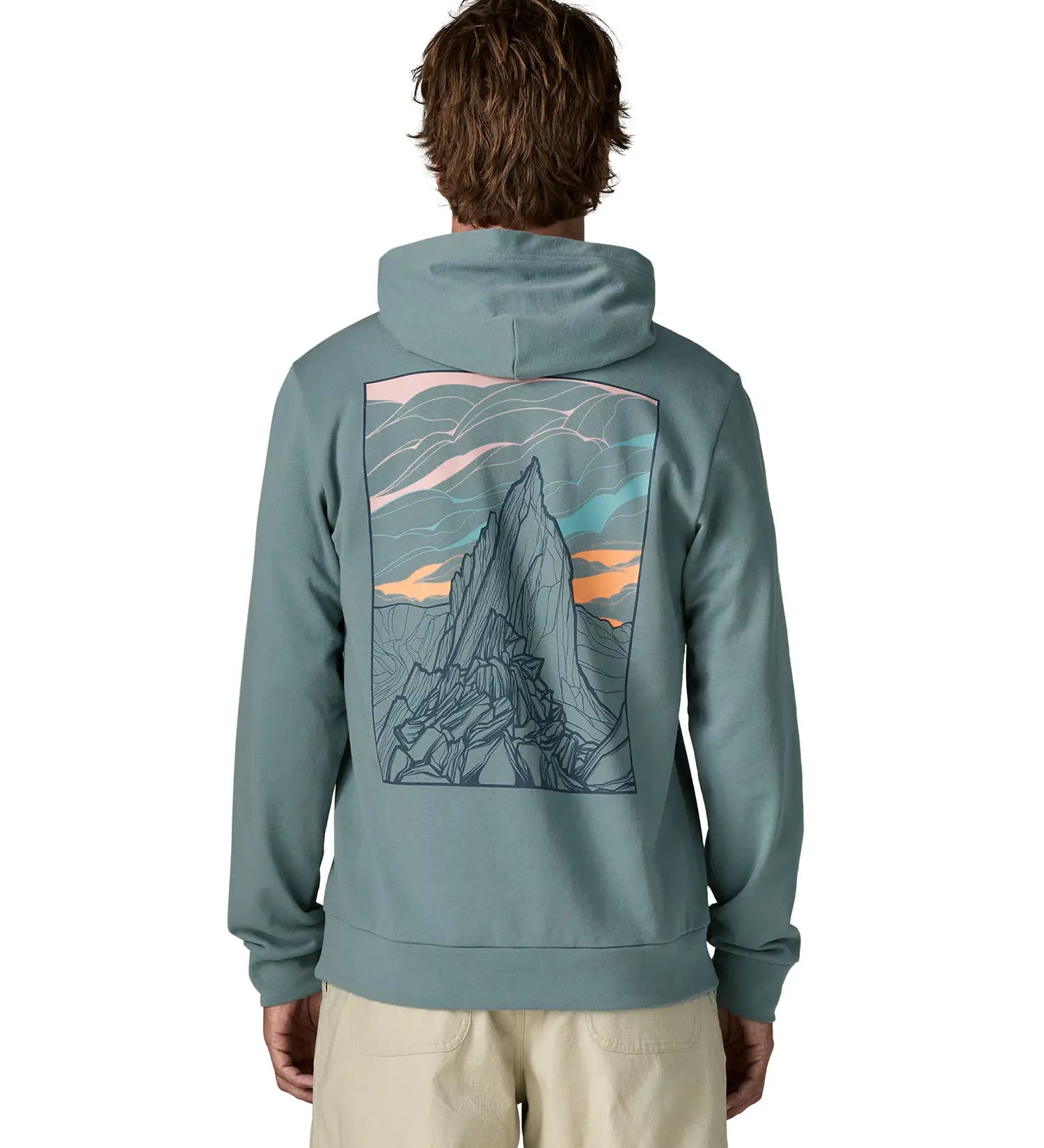 Back of man wearing a Patagonia cloud crag daily hoody in sage blue showing a large minimalistic geometric style print of a mountain ridge. Hoodie has a relaxed fit