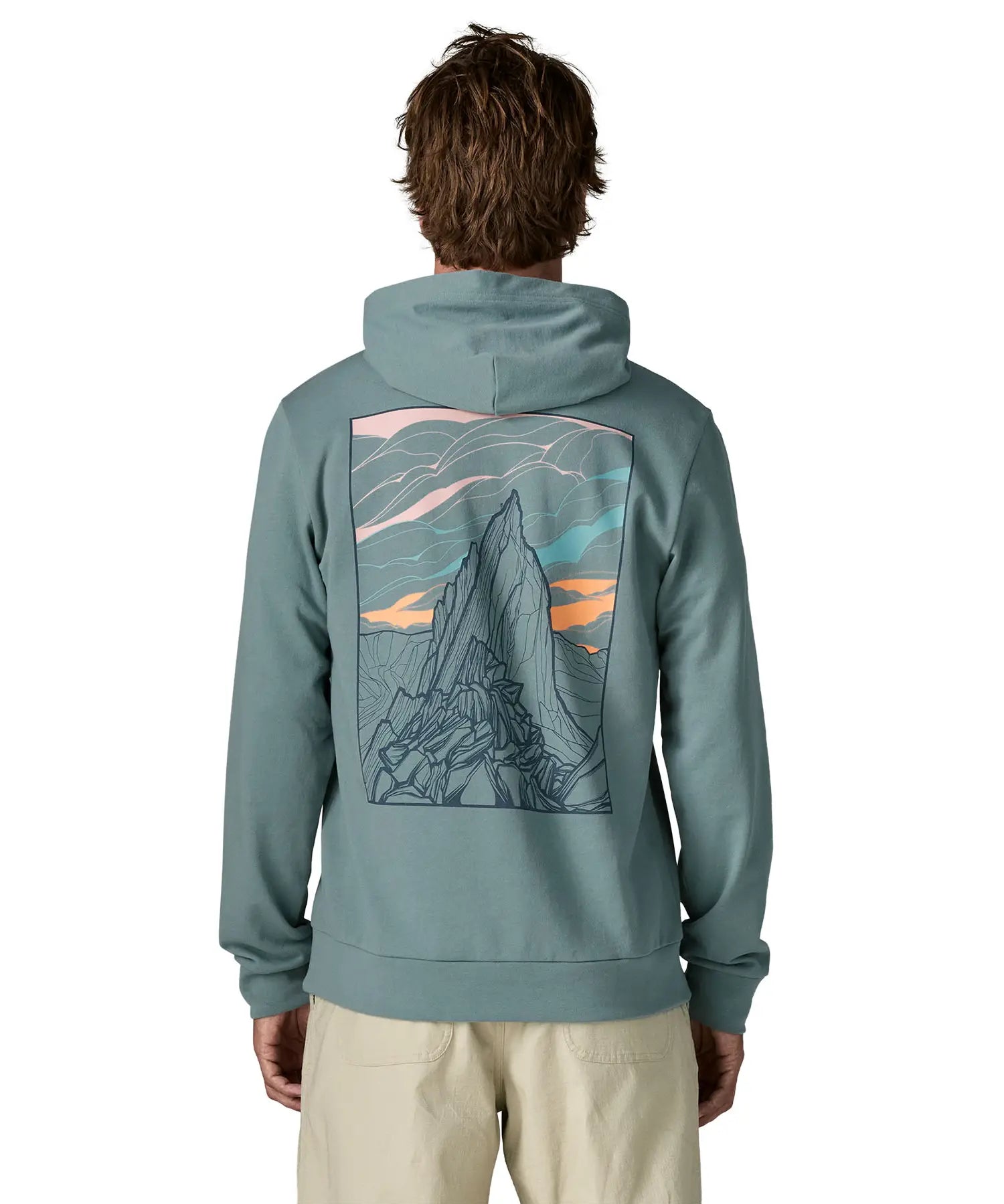Back of man wearing a Patagonia cloud crag daily hoody in sage blue showing a large minimalistic geometric style print of a mountain ridge. Hoodie has a relaxed fit
