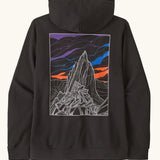 Patagonia mens cloud crag daily hoody in black showing a large minimalistic geometric style print of a mountain  ridge