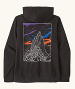 Patagonia mens cloud crag daily hoody in black showing a large minimalistic geometric style print of a mountain  ridge