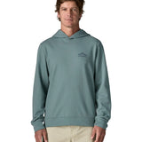 Front of man wearing a Patagonia cloud crag daily hoody in sage blue showing a small mountain print on upper chest
