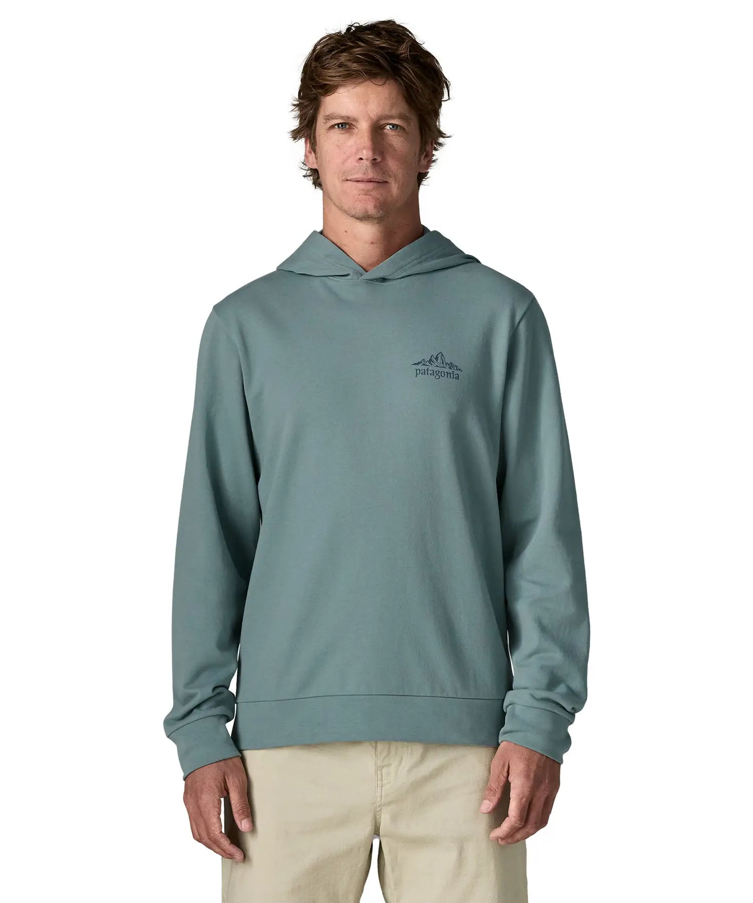 Front of man wearing a Patagonia cloud crag daily hoody in sage blue showing a small mountain print on upper chest