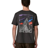 Man wearing Patagonia's  cloud crag short sleeve t-shirt in black showing a large mountain ridge graphic on the back