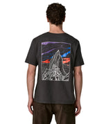 Man wearing Patagonia's  cloud crag short sleeve t-shirt in black showing a large mountain ridge graphic on the back