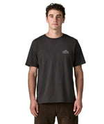 Man wearing Patagonia's  cloud crag short sleeve t-shirt in black showing a small mountain ridge graphic on the chest