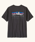 Patagonia men's fitz roy foothills short sleeve t-shirt in black  showing a large mountain branded print on the upper back. 
