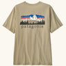 Patagonia men's fitz roy foothills short sleeve t-shirt in beige showing a large mountain branded print on the upper back. 