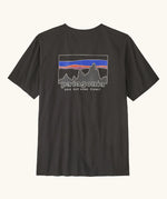 Patagonia men's 100% organic cotton 73 skyline t-shirt in black with a mountain range logo on the upper back