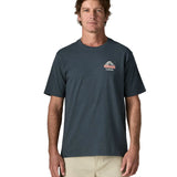 Man wearing Patagonia men's great waves responsibili short sleeve shirt in dark blue with small wave graphic on chest