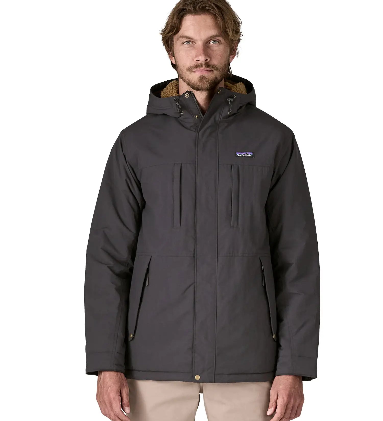 Man wearing Patagonia water repellent Isthmus parka in ink black showing full front zip and popper fastened and pockets