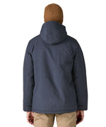 Back of man wearing Patagonia's isthmus parka jacket in dark blue. Jacket has a relaxed fit and sits at the hips