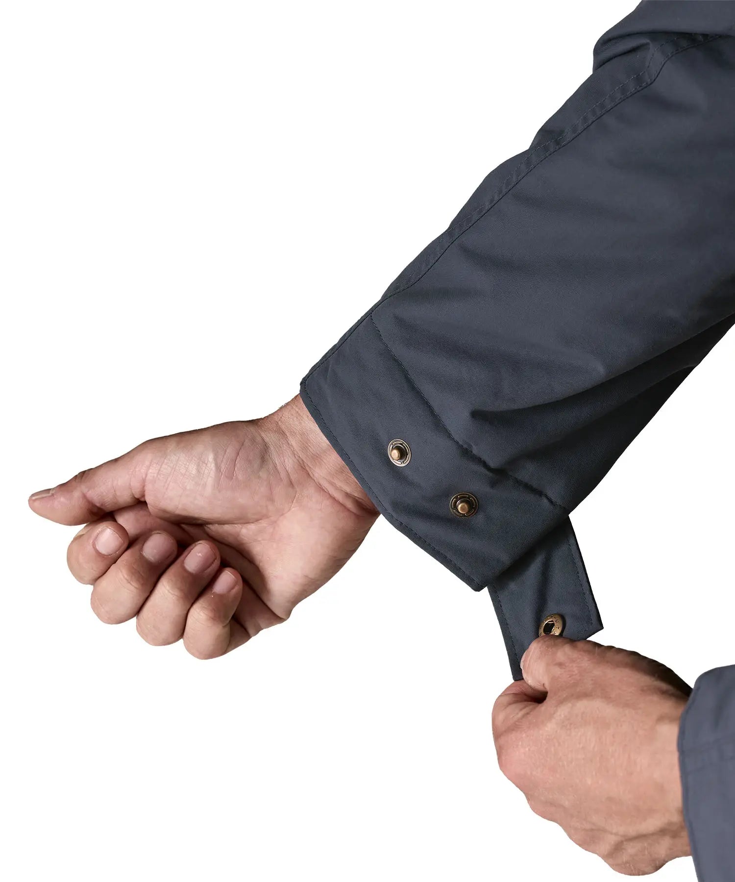 Man adjusting cuff size using the poppers on the Patagonia's isthmus parka jacket in dark blue 