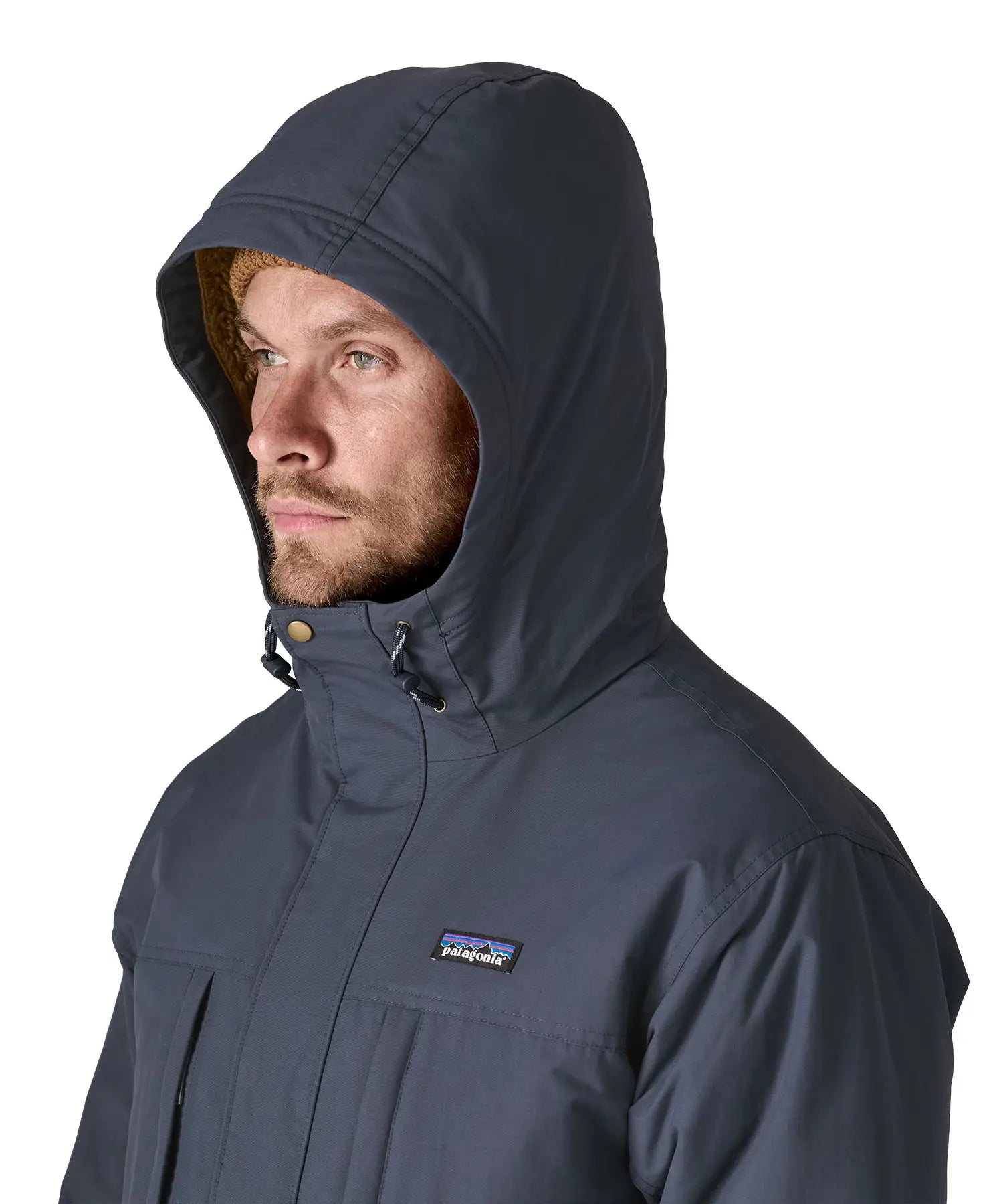 Patagonia's isthmus parka jacket in dark blue with the hood over the head showing toggles for tightness adjustment