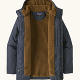 An open Patagonia men's isthmus parka jacket in dark blue showing the brown inner fleece