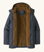 An open Patagonia men's isthmus parka jacket in dark blue showing the brown inner fleece