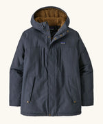 Patagonia men's isthmus parka jacket in dark blue with brown inner fleece. Showing full length front zip, side and chest pockets