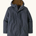 Patagonia men's isthmus parka jacket in dark blue with brown inner fleece. Showing full length front zip, side and chest pockets