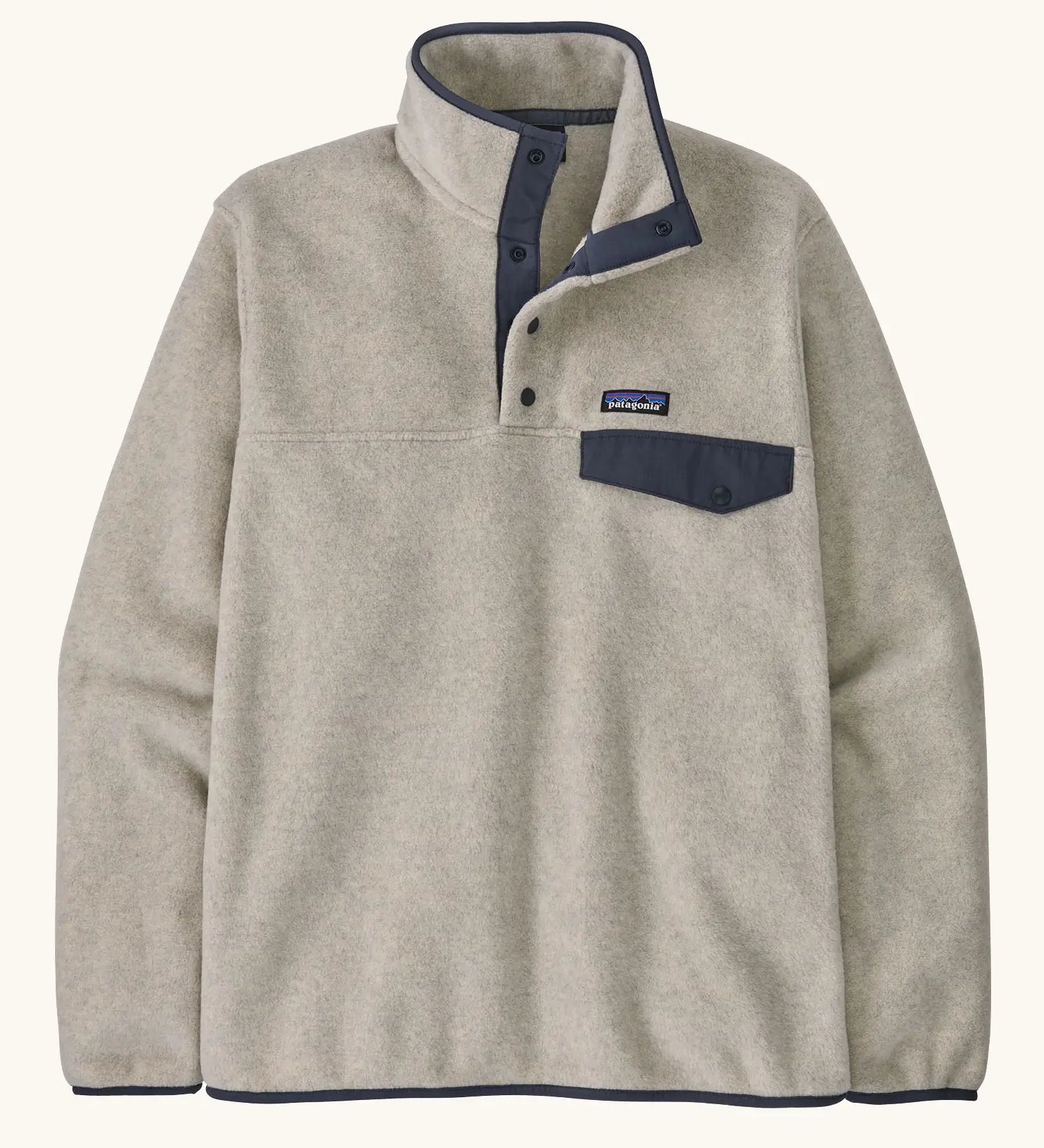 Patagonia mens lightweight synchilla snap t fleece pullover in beige with navy trim. Features 1/4 length popper fasteners and a chest pocket
