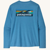 Patagonia men's long sleeve capilene cool t-shirt in light blue with wave logo graphic on upper back