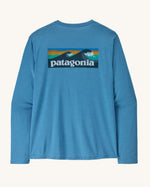 Patagonia men's long sleeve capilene cool t-shirt in light blue with wave logo graphic on upper back