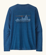 Patagonia men's long sleeve capilene techincal t-shirt in blue with 73 skyline inspired brand print on upper back