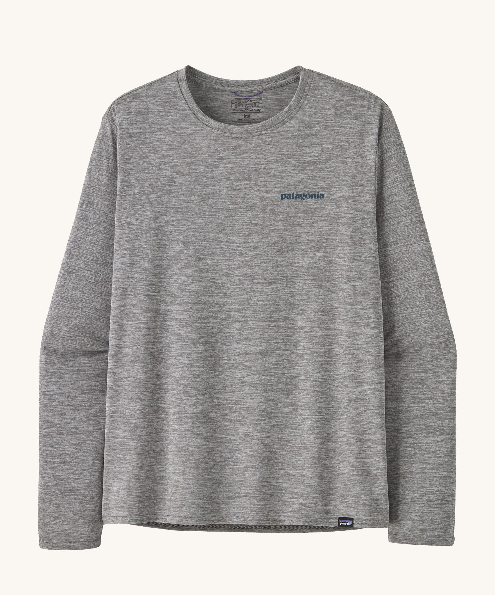 Front view of the Patagonia Men’s Long Sleeved Capilene Cool Daily Graphic Shirt in Waters grey marl, showing the small Patagonia logo on the left chest.