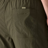 Close up of Patagonia's men's outdoor everyday quick drying shorts in green. Shows back pocket