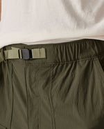 Close up of Patagonia men's outdoor everyday quick drying shorts in green showing light green belt.