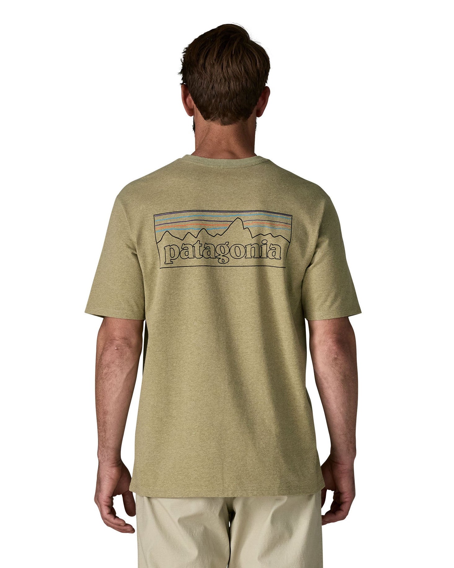 Man wearing Patagonia's men's responsibili t-shirt in green with large logo patch on the upper back. T-shirt has a relaxed fit
