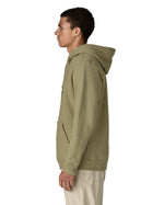 Side of man wearing Patagonia's P-6 Logo Uprisal Hoody in a pale green with the hood down. Hoody has a relaxed fit and sits at hips