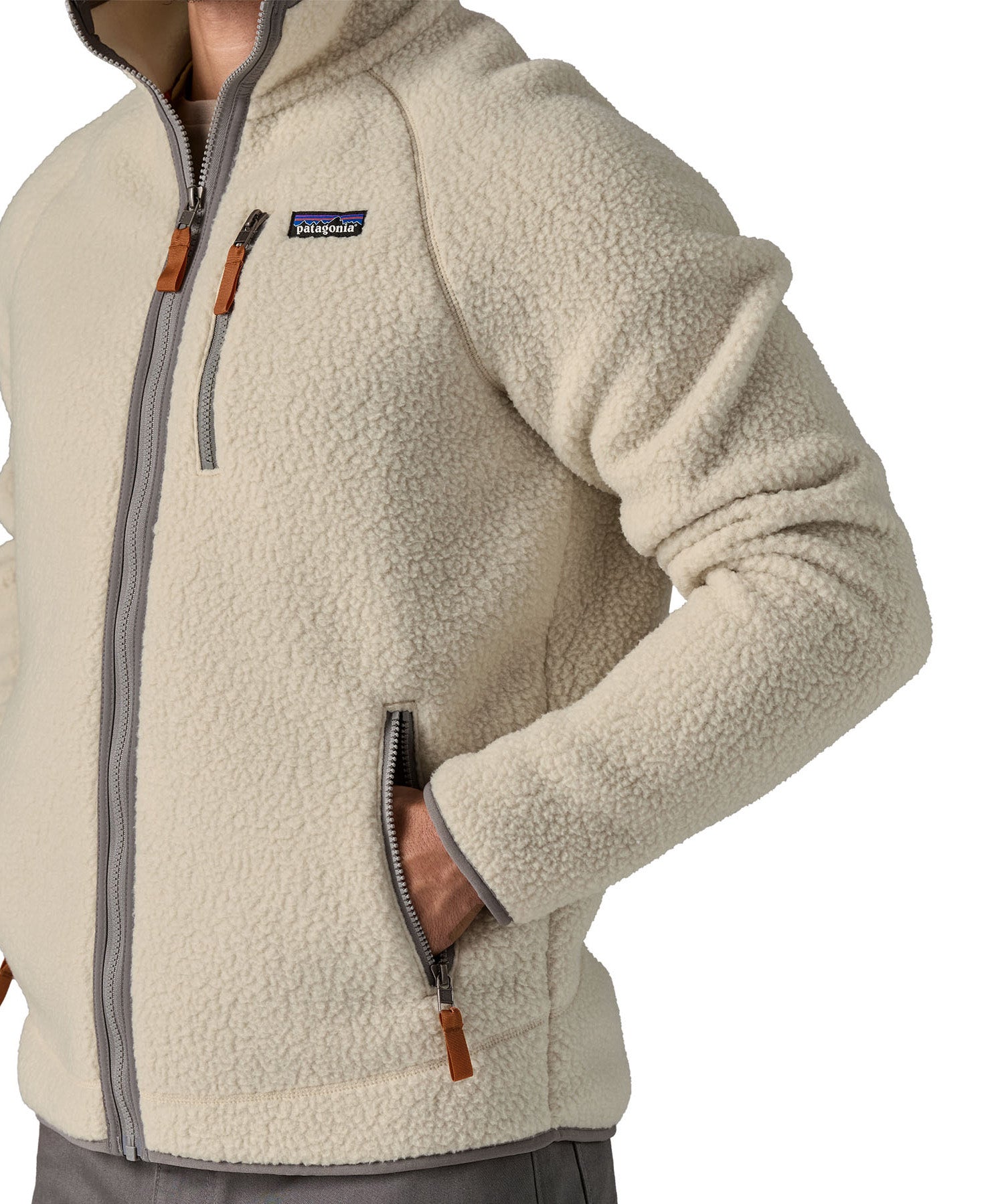 A close up of a man wearing the Patagonia Men's Retro Pile Fleece Jacket in a Pelican colour available at Babipur showing the full zip length and pocket detail