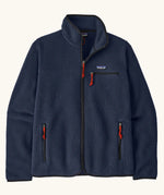 Patagonia men's retro pile fleece jacket in new navy with black trim. Features a full front zip, chest and side pockets