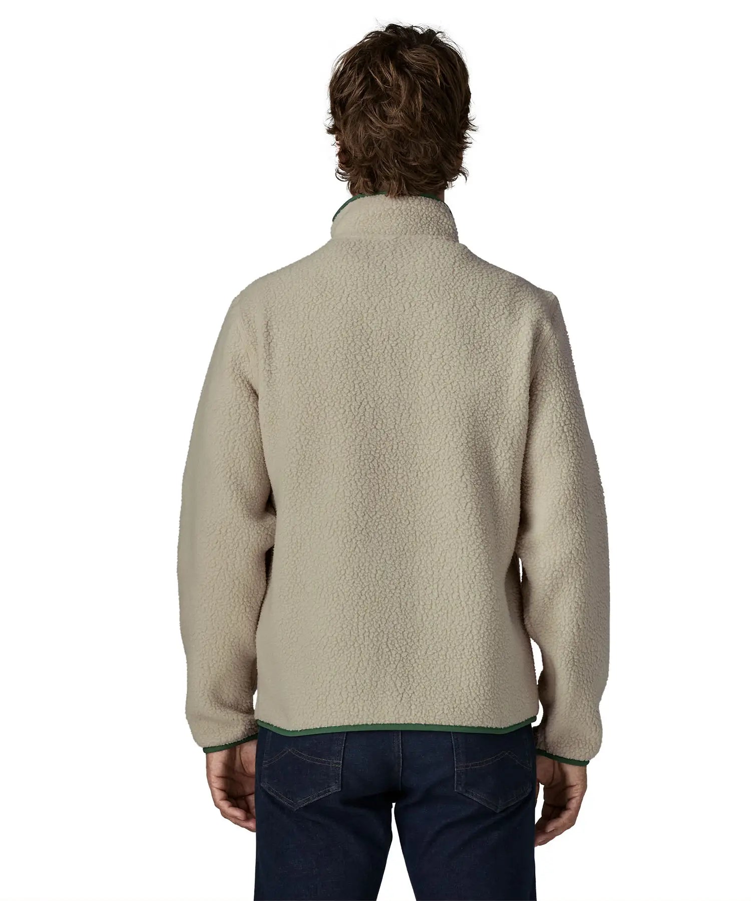Back of man wearing a Patagonia retro pile jacket in beige with a green trim. Fleece has a relaxed fit