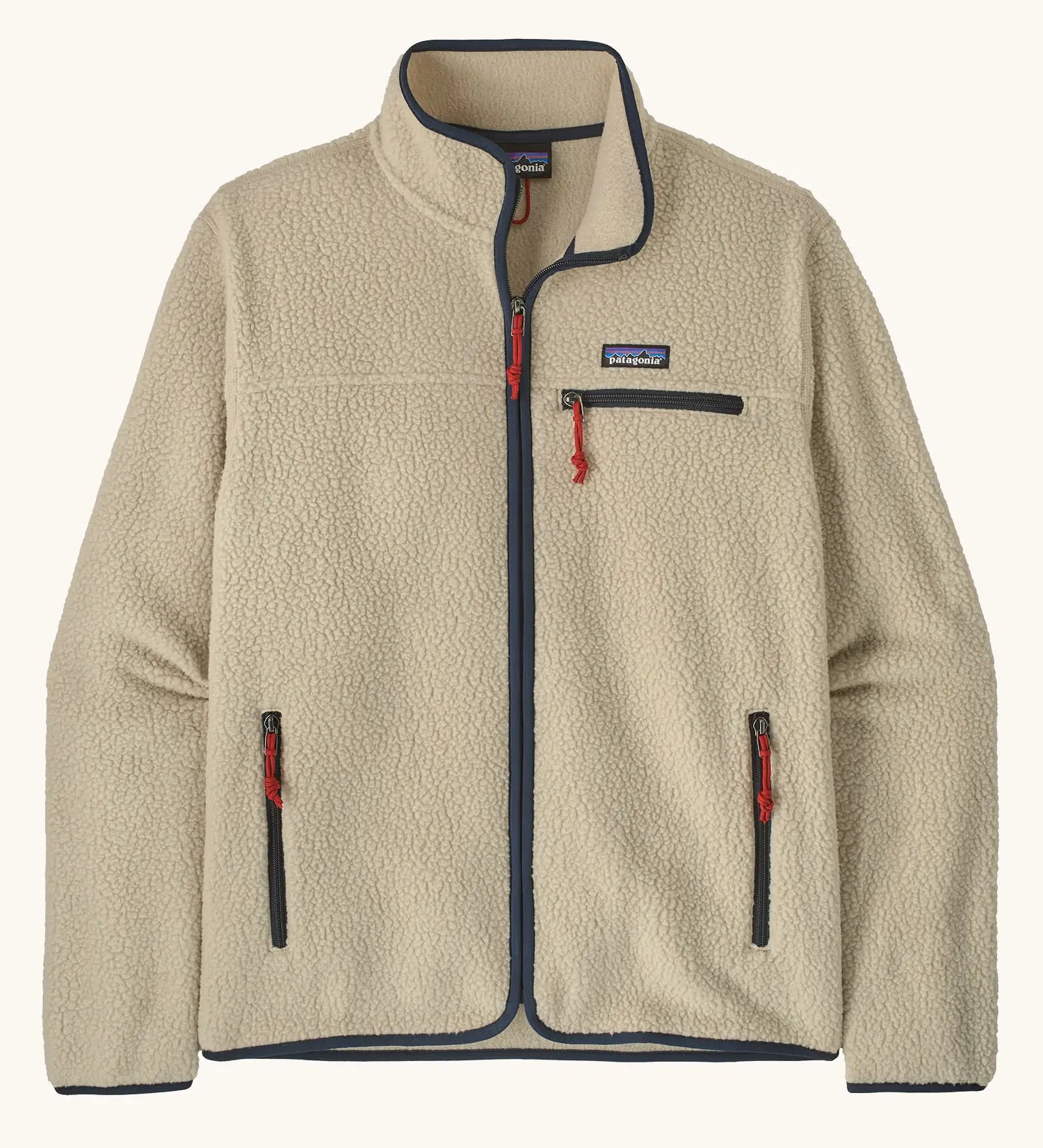 Patagonia men's retro pile fleece jacket in beige with navy trim. Features a full front zip, chest and side pockets
