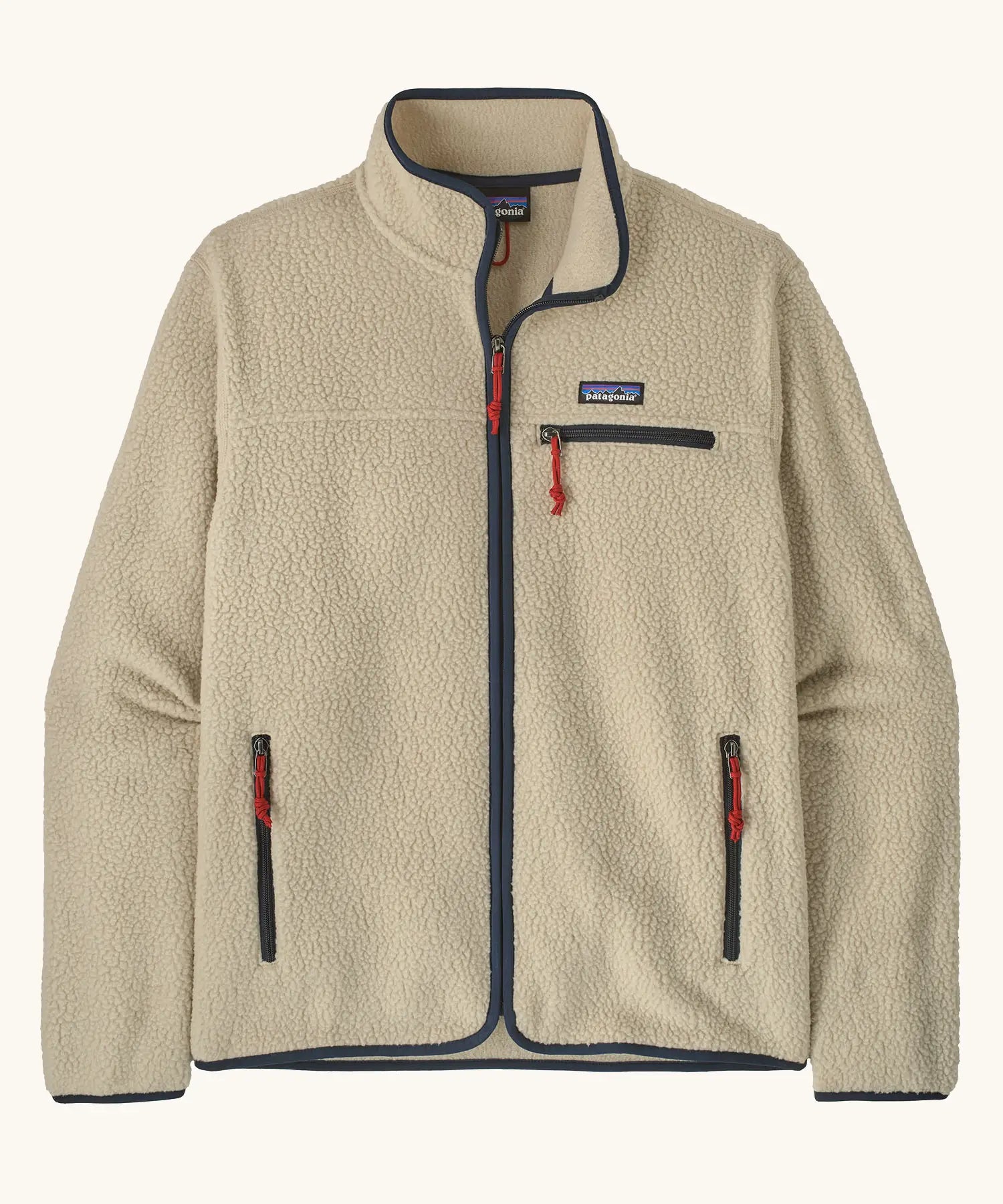 Patagonia men's retro pile fleece jacket in beige with navy trim. Features a full front zip, chest and side pockets