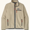 Patagonia men's retro pile fleece jacket in beige with navy trim. Features a full front zip, chest and side pockets